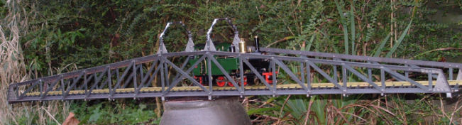 Completed bridge with track and loco in approximate position in the garden